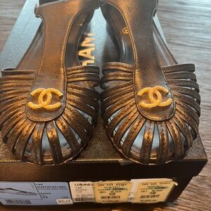 CHANEL Black Flats with Gold Logo Accent
